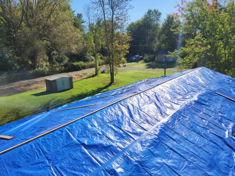 Temporary roof protection with tarp and strapping – Trenton