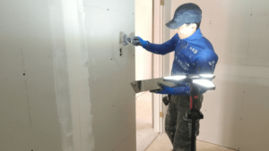 mudding a wall in basement