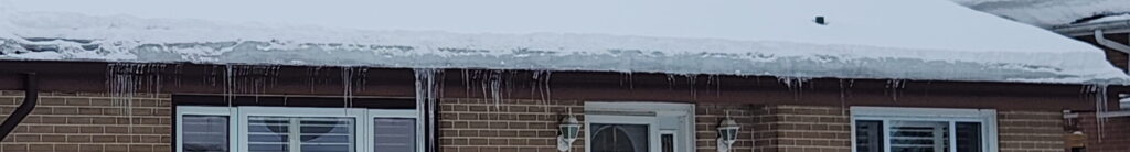 Ice accumulation on metal roof in Belleville winter