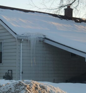 Snow melting and refreezing on roof causing ice dam in Trenton